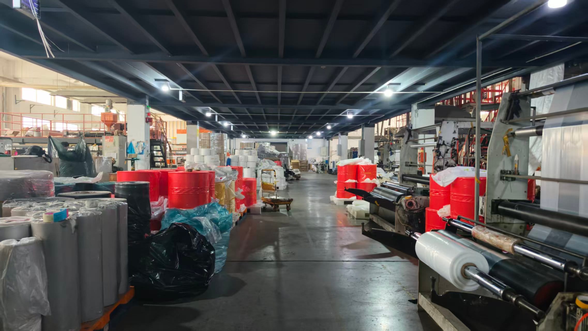 Stretch film production workshop with industrial film rolls